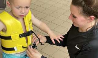 Mum Fastening Life Jacket